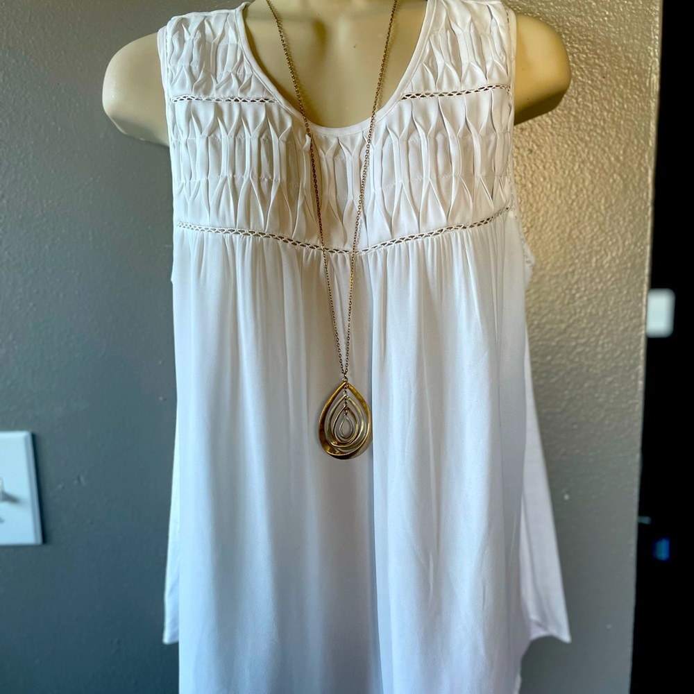 White sleeveless top